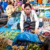 A woman at the market in Thakhek is hiding kha-nyou, which she is selling. Photo: Miroslav Bobek